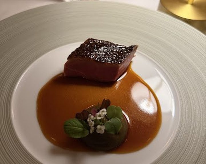 A composed meat course with sauce at Ormer Mayfair