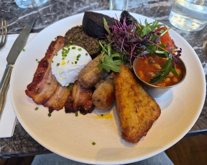 Brunch plate with eggs, bacon, toast and beans at Pantry Bruntsfield