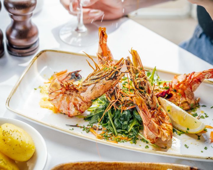 Grilled giant prawns with lemon at Alexander The Great in Camden