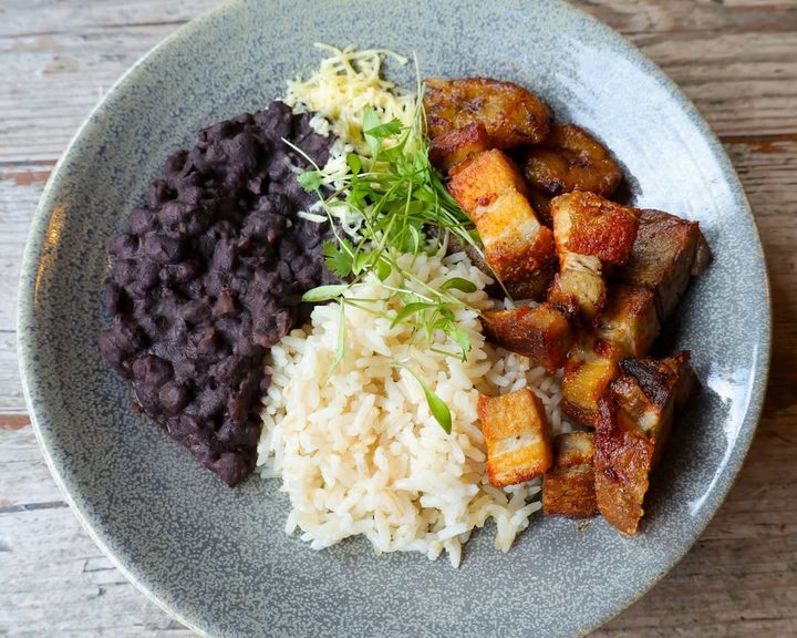 Arepa & Co rice bowl with pork belly, black beans and plantain