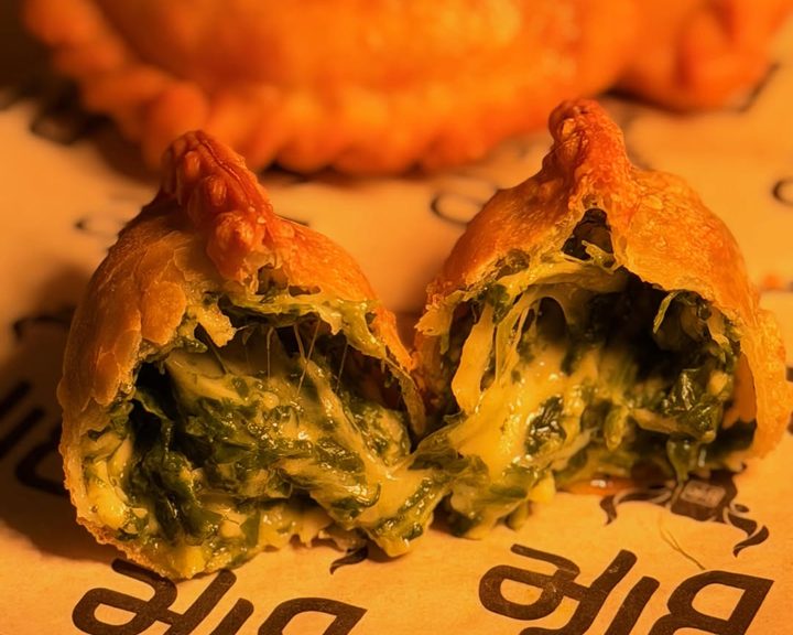 Spinach and cheese empanadas with crisp pastry at Bife