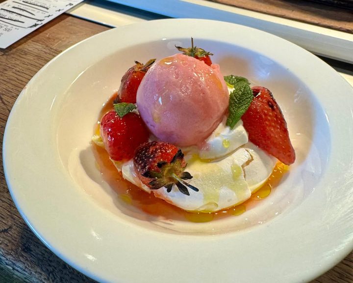 Grilled strawberry dessert with meringue and rhubarb sorbet at Brat