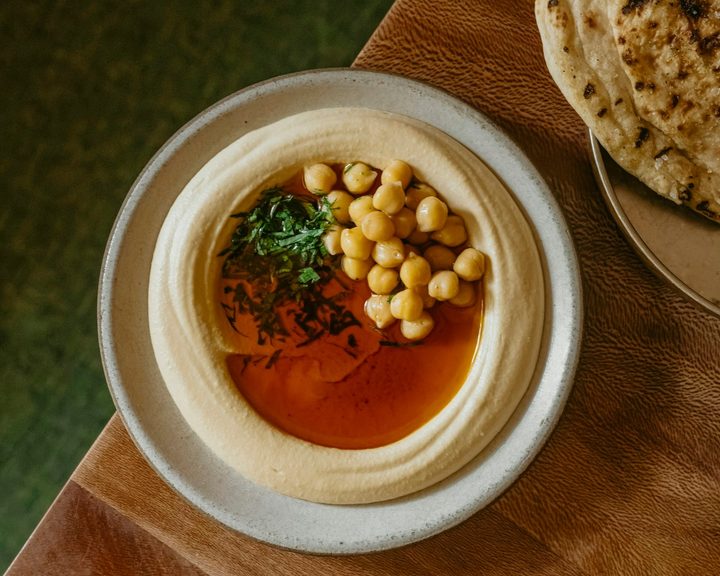 Hummus with burnt butter, chickpeas and bread at Bubala