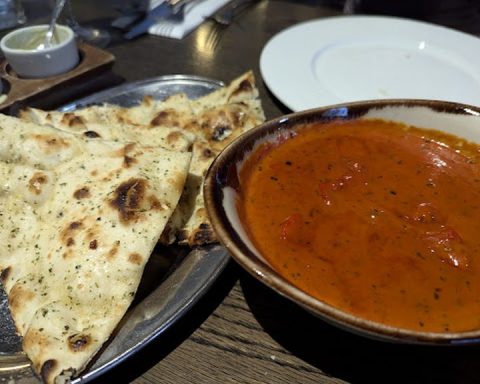 Curry, naan and rice at an Indian restaurant in Belfast