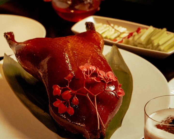 Glazed Peking duck with flower garnish at Hakkasan Mayfair