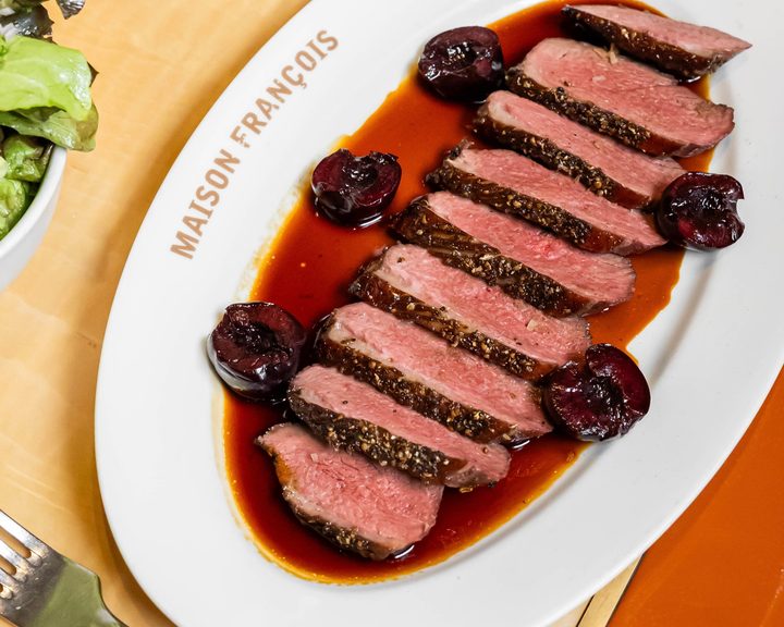 Spiced roast duck with cherries at Maison François
