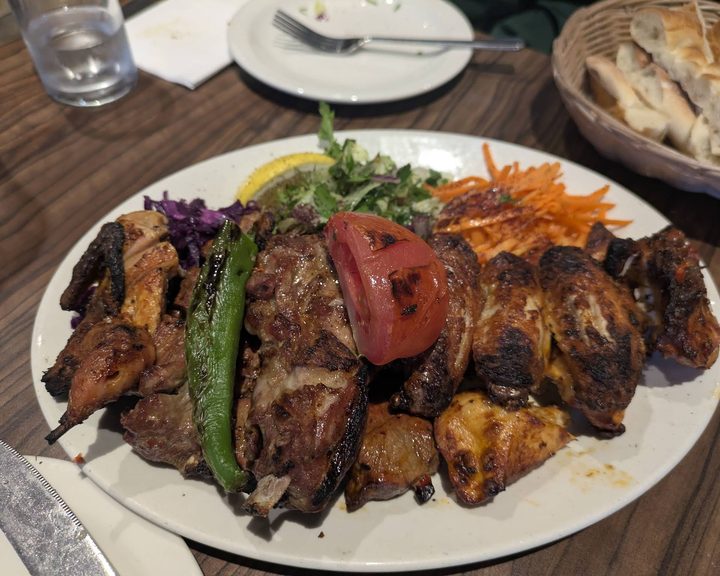 Mixed charcoal-grilled meats with salad at Meze Mangal