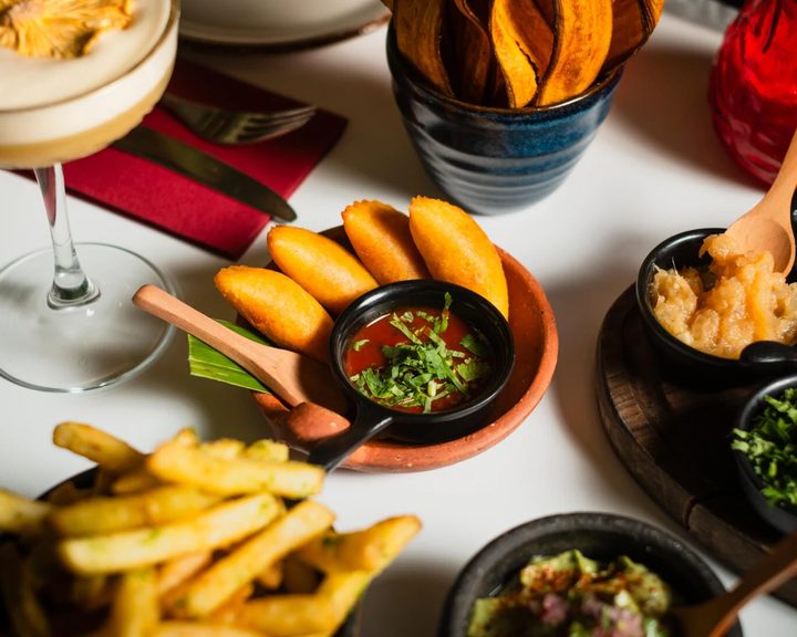 Latin American sharing dishes, croquettes and plantain crisps at Paladar