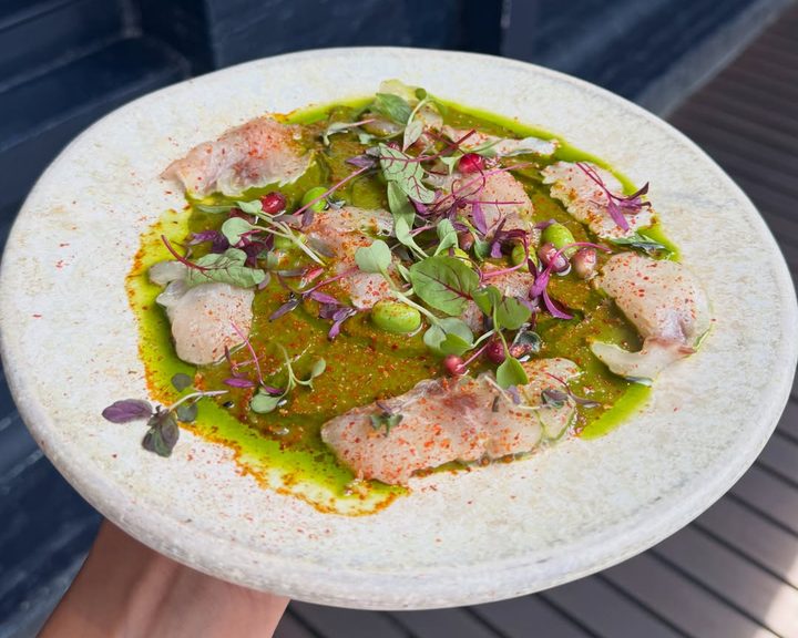 Sea bass Tiradito Limeño with green sauce and pomegranate at Señor Ceviche