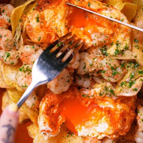 Garlic prawns with fried eggs and crisps at Sabor in London
