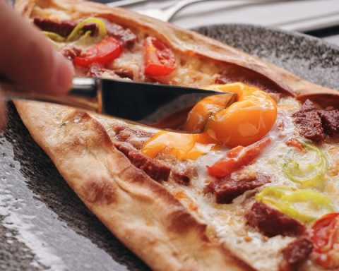 Freshly baked pide with egg at Şelale Restaurant in Harringay